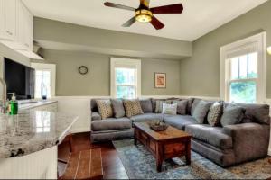 a living room with a couch and a ceiling fan at Charming, cozy, one bedroom apartment in Lakeland