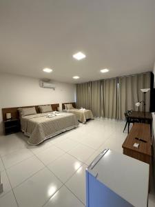 Postel nebo postele na pokoji v ubytování Hotel Formosa - Posto da Mata