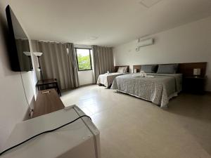 Postel nebo postele na pokoji v ubytování Hotel Formosa - Posto da Mata