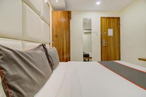 Postel nebo postele na pokoji v ubytování Hotel O Address Inn