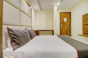 Postel nebo postele na pokoji v ubytování Hotel O Address Inn