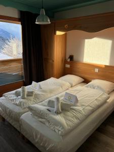 Ένα ή περισσότερα κρεβάτια σε δωμάτιο στο Chalet Alpaka