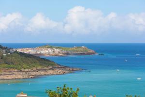 an island in the ocean with boats in the water at Ocean View in Carbis Bay