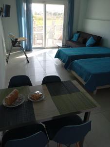 A bed or beds in a room at Lighthouse Apartments