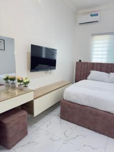 TV a/nebo společenská místnost v ubytování Goldeekoin Apartment and Hotel + 9 fotografií