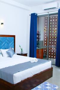 En eller flere senge i et værelse på TAffy REsort