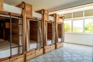 a group of bunk beds in a room at Lisbon Surf Hostel in Carcavelos +29 photos