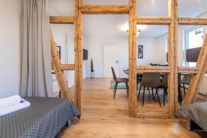 a bedroom with a table and a dining room at Apartment - Modern - Küche in Gotha +16 photos