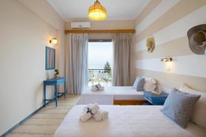 Postel nebo postele na pokoji v ubytování Casa Dei Venti Sea View Appartments