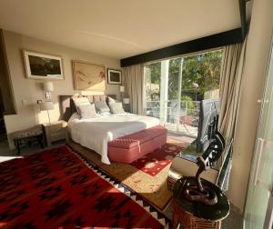 a bedroom with a bed and a tv in it at Marbella Boutique Art suites in Marbella +37 photos