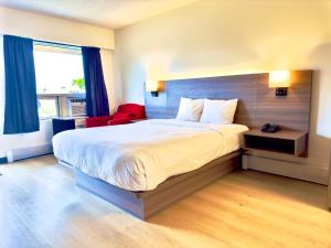 Postel nebo postele na pokoji v ubytování Westport Inn