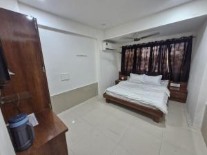 Letto o letti in una camera di Hotel Paradise