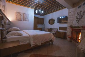 Postel nebo postele na pokoji v ubytování Kallinikos Guesthouse