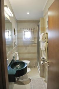 a bathroom with a sink and a toilet at Hotel Kent in Rome