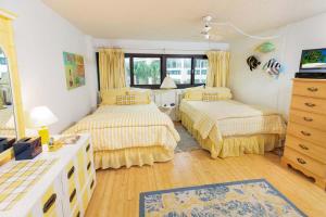 Ένα ή περισσότερα κρεβάτια σε δωμάτιο στο Sunset Paradise 3 Bedroom Condo Resort Amenities