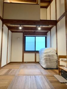 a large room with a large window and a mattress at Ieka Village Kiyosasawa - Vacation STAY 33015v in Sadamitsu