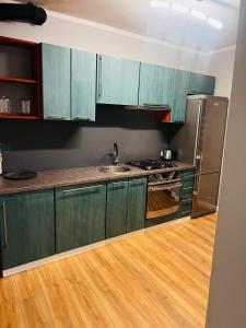 Kuchyň nebo kuchyňský kout v ubytování Apartament na Grodowej koło Rynku