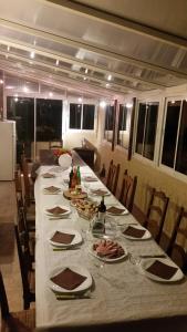 a long table with plates of food on it at Les 2 Alpes in Puget-Théniers