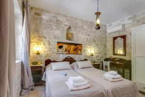 Posteľ alebo postele v izbe v ubytovaní Villa Vincenzos by Villa Plus