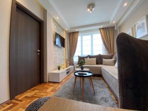 TV a/nebo společenská místnost v ubytování LaKop Apartman