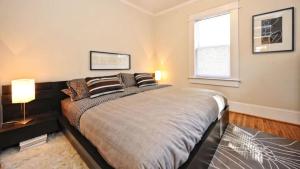 a bedroom with a large bed and a window at Chic 1 BR Units Near Dilworth in Charlotte