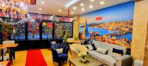 a restaurant with a large mural of a harbor at By Historial Hotel Due in Istanbul