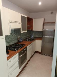 A kitchen or kitchenette at City Break Nomentana
