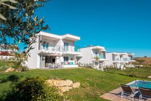a villa with a view of the house at Sani Beverly Hills Luxury Villas in Sani Beach
