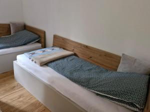 two beds sitting next to each other in a room at Green peace-Bjelašnica in SJJ