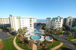 an aerial view of a resort with a swimming pool at Whitney Parish Retreat Beachfront Bliss in Pawleys Island