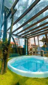 a hot tub in the middle of a building at Pousada Bella Praia in Torres