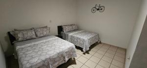 Postel nebo postele na pokoji v ubytování Suites Sta Tere