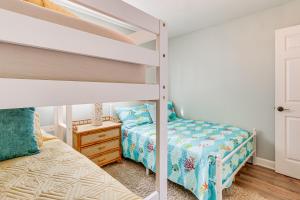 a bedroom with two beds and a bunk bed at Wright by the Beach Hilton Head Condo with Perks in Hilton Head Island +23 photos