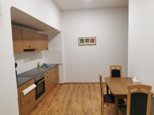 a kitchen with a table and a dining room at 1-Zimmer Wohnung in Herne