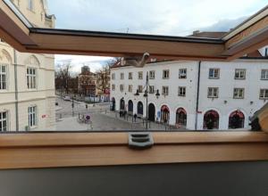 a view of a city from a window of a building at BellaCiaoApartment in České Budějovice