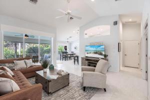 a living room with a couch and a table at 316 Marco in Marco Island