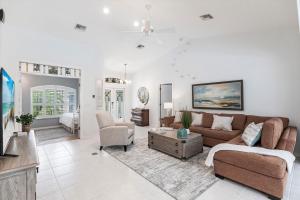 a living room with a couch and a tv at 316 Marco in Marco Island