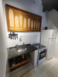 A cozinha ou cozinha compacta de Pousada Pitaya Maresias mais 34 fotos
