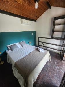 Cama ou camas em um quarto em Pousada Pitaya Maresias
