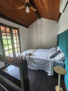Cama ou camas em um quarto em Pousada Pitaya Maresias