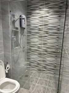 a bathroom with a shower stall with a toilet at Serene Terrace House 2-12pax &Sunrise View in Brinchang +27 photos