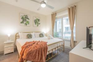 a bedroom with a bed and a large window at Trendy Riverwalk Retreat King Bed Free Parking Pool Gym in San Antonio +40 photos