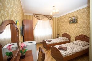 Postel nebo postele na pokoji v ubytování Goldenluxe