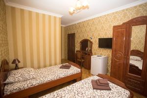 Postel nebo postele na pokoji v ubytování Goldenluxe