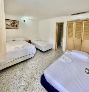Postel nebo postele na pokoji v ubytování Hotel Casa Fátima
