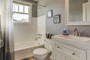 a bathroom with a sink toilet and a window at 4 Mi to Baton Rouge Charming Duplex Apartment in Port Allen +19 photos