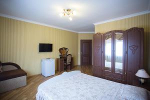 Postel nebo postele na pokoji v ubytování Goldenluxe