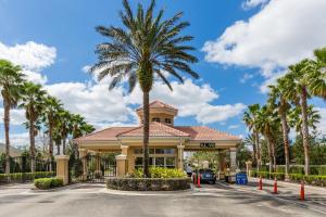 a palm tree in front of a building at One in a Minion #102 in Orlando