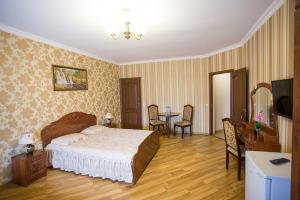 Postel nebo postele na pokoji v ubytování Goldenluxe