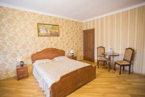 Postel nebo postele na pokoji v ubytování Goldenluxe